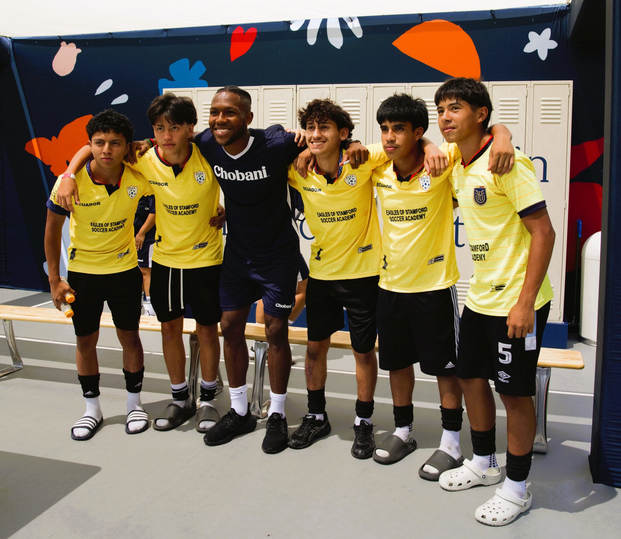 Andres Perea with kids in yellow kits at a Chobani appearance in New York.