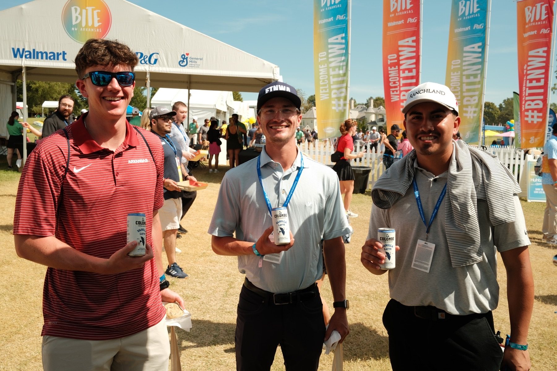 Attendees holding La Colombe Draft Lattes at BITE NWA.